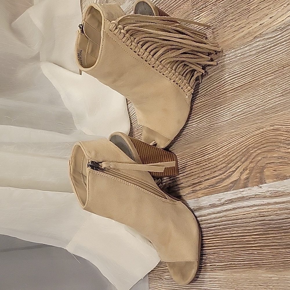 Creamy colored tan fringe boots